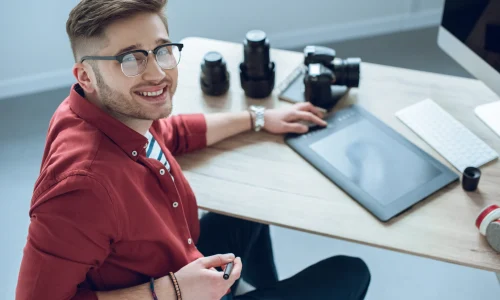 happy-freelancer-man-sitting-by-working-table-with-2026-01-05-23-41-52-utc
